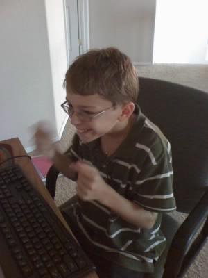 Jaiden excited to play on the computer -- any ideas what game he's about to play?