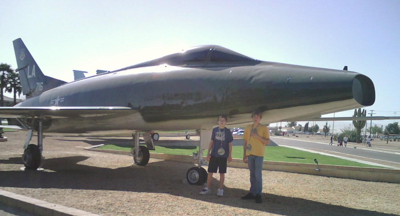 Jaiden and Hayden in front of an F-100 plane